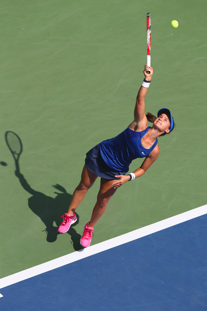 Lauran Davis servs during the US Open 2014 against Samantha Stosur, Photo: L. Zhukovsky, Shutterstock